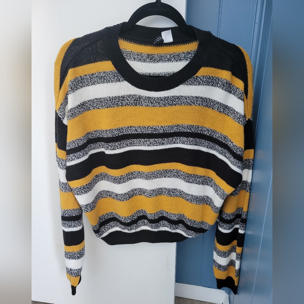 Black, white, and yellow striped sweater